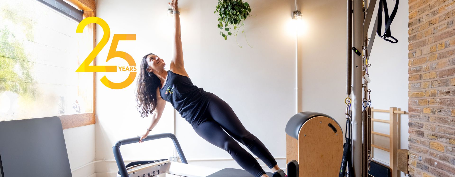 Woman performing a Pilates pose on a reformer machine in Cheetah Gym, with headline ‘Group Classes’ — highlighting diverse fitness options and group training sessions in Chicago.