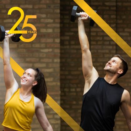 Two people performing shoulder presses in Cheetah Gym with promotional text highlighting a free gym pass — showcasing strength training and fitness facilities in Andersonville, Chicago.